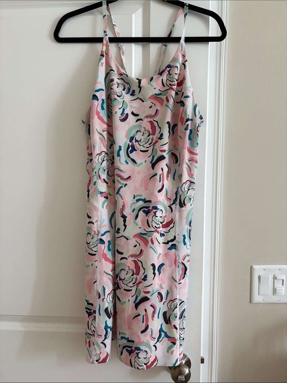 Athleta Pink Floral Dress with shorts underneath.